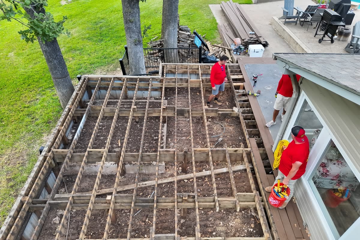 Deck rebuild — old boards out, framing assessed before new decking
