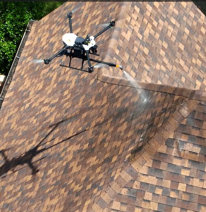 Drone applying GoNano to a shingle roof