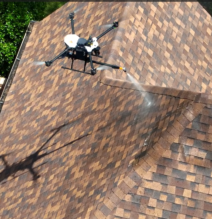 Drone applying GoNano to a shingle roof